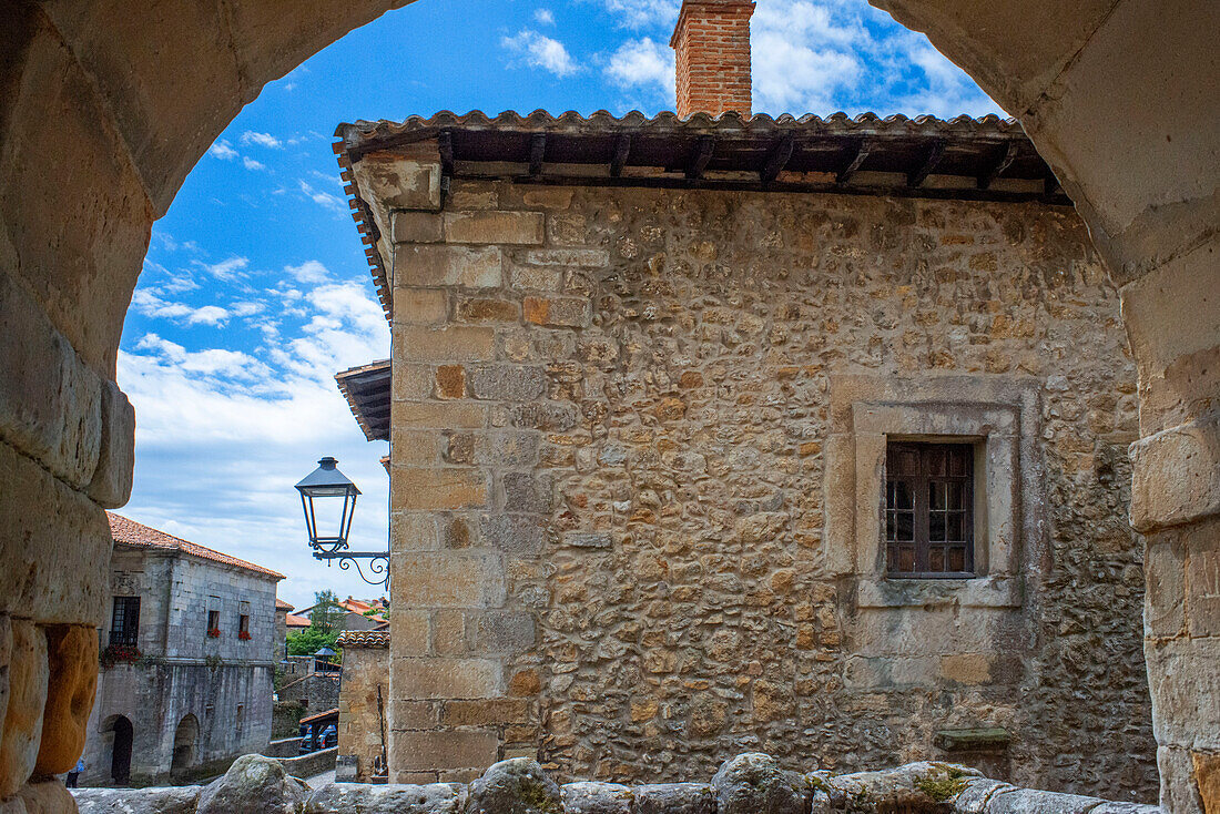 Past medieval buildings along cobbled street of Calle Del Canton in Santillana del Mar, Cantabria, Northern Spain