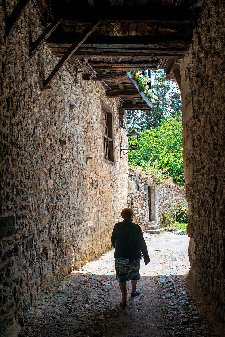 Past medieval buildings along cobbled street in Santillana del Mar, Cantabria, Northern Spain