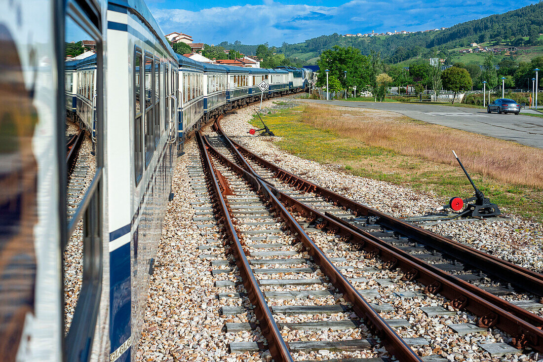 Outisde carriages of Transcantabrico Gran Lujo luxury train travellong across northern Spain, Europe. Journey between Cabezon de la Sal and Llanes.