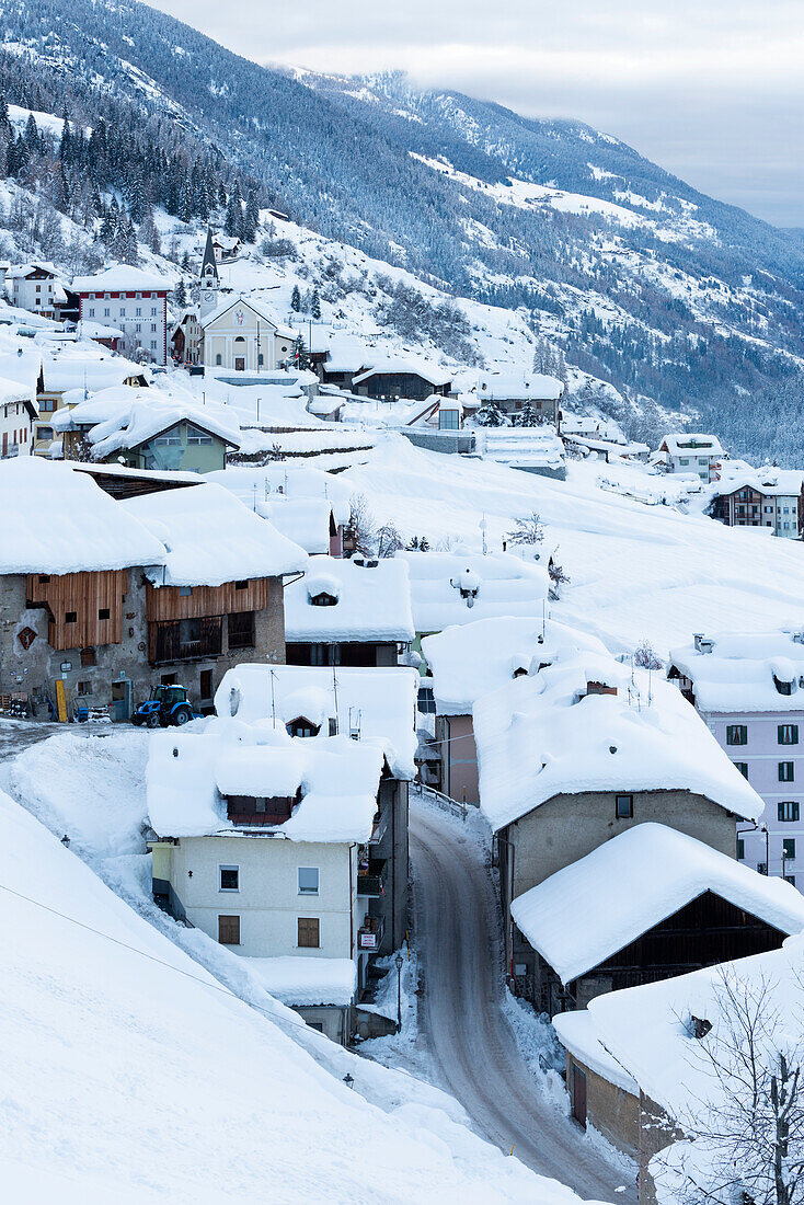 Fraviano village in winter season. Europe, Italy, Trentino Alto Adige, Sun valley, Vermiglio municipality, Trento province
