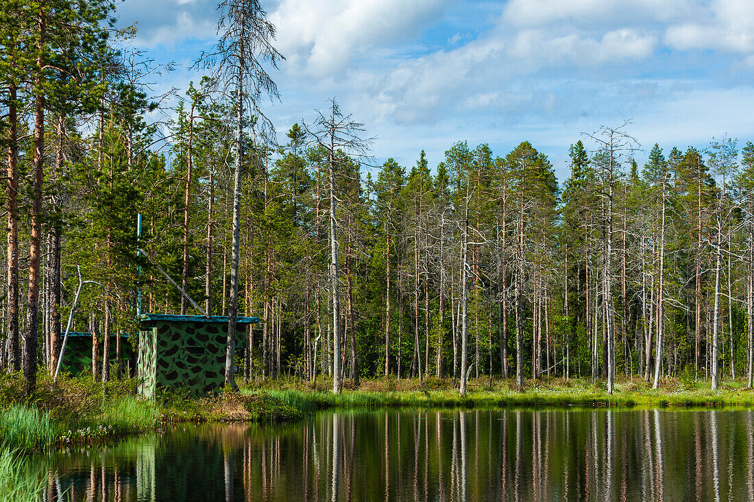 Photo hides on a lake shore. Kuhmo, Oulu, Finland.