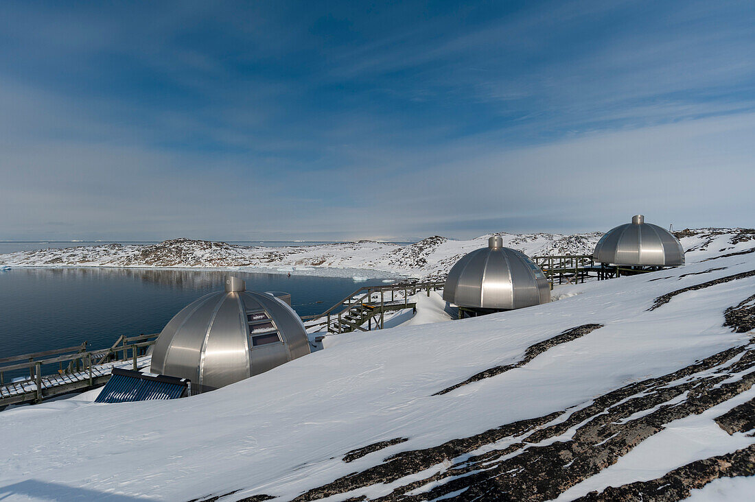 Aluminium igloos at the Hotel Arctic In Ilulissat with a view on Disko Bay. Disko Bay, Ilulissat, Greenland.