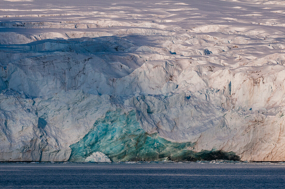 Sunlight and shadows on a glacier fronting Magdalenefjorden. Magdalenefjorden, Spitsbergen Island, Svalbard, Norway.