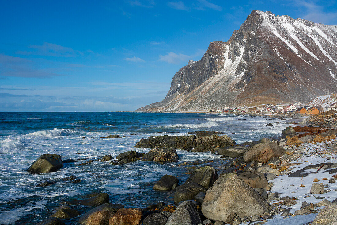 A view of the village of Vikten and rocky coastline. Vikten, Lofoten Islands, Nordland, Norway.