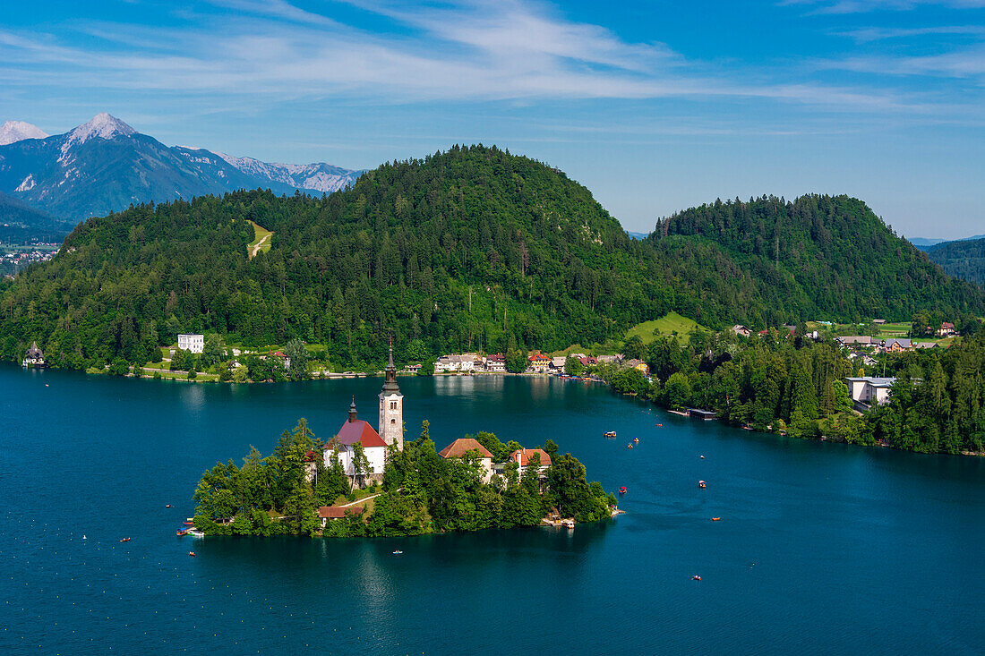 A view from above of the lake Bled and the Assumption of Mary Pilgrimage Church. Bled, Slovenia