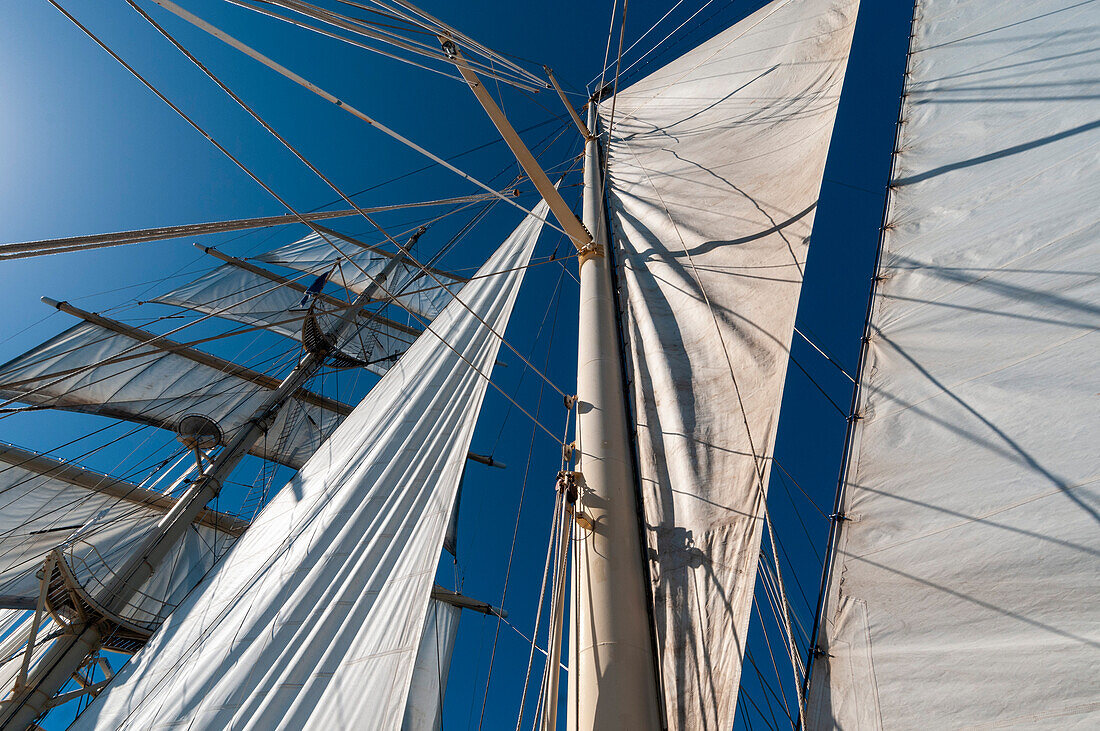 Looking up the at the masts and sails of a barquentine cruise ship. Near Nevis Island, West Indies.