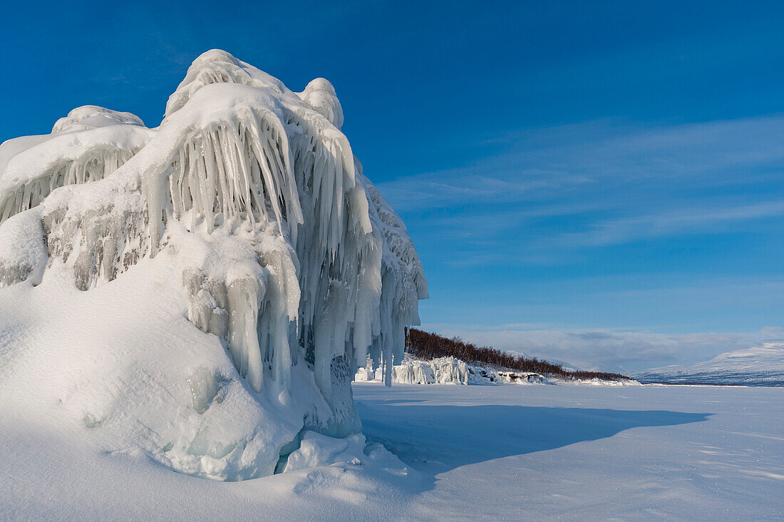 Landscape view of frozen Tornetrask Lake. Sweden.