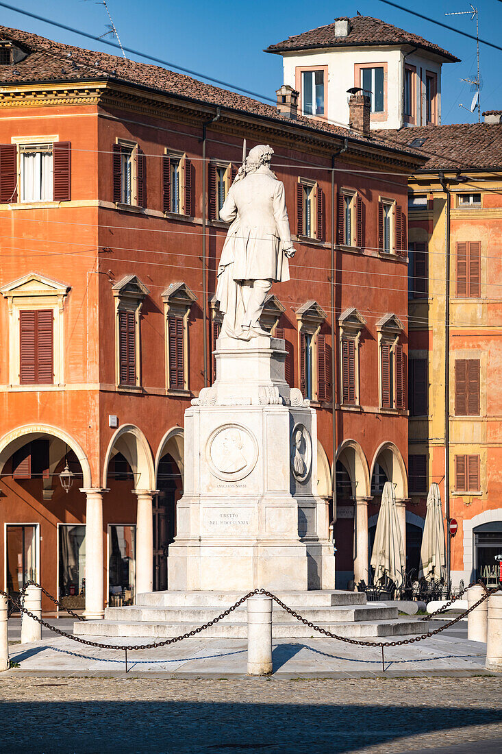 Piazza Roma, iconic square in Modena old town, with .Ciro Menotti statue Modena, Emilia Romagna, Italy