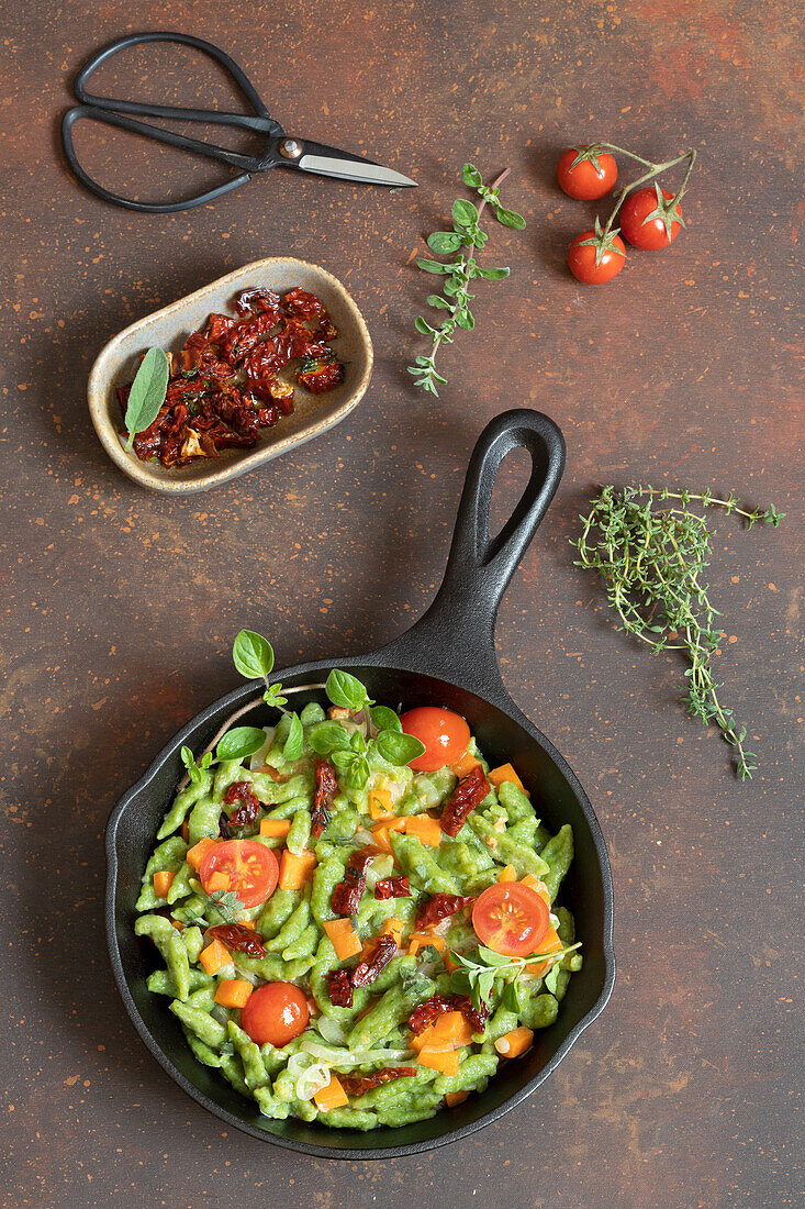Green spaetzle with ricotta cream and tomatoes
