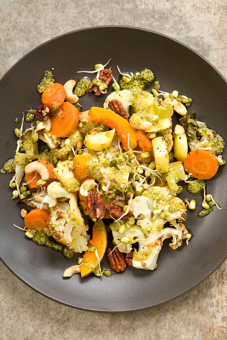 Roasted vegetables with pesto and pecans