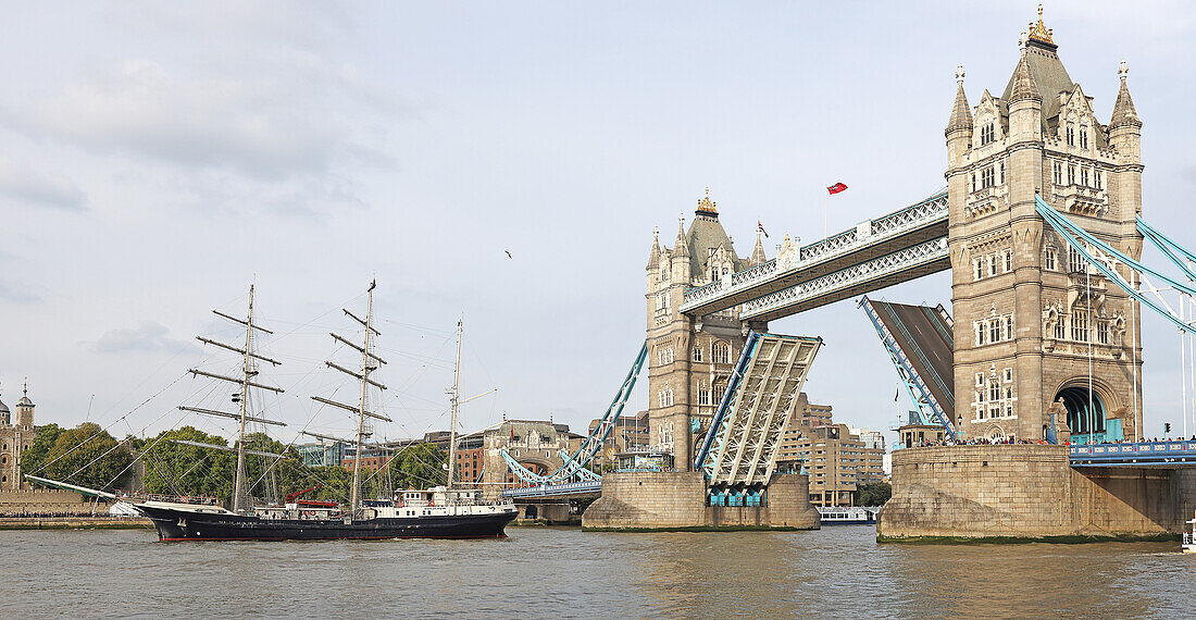 Tower bridge with tall sailing ship, London, UK