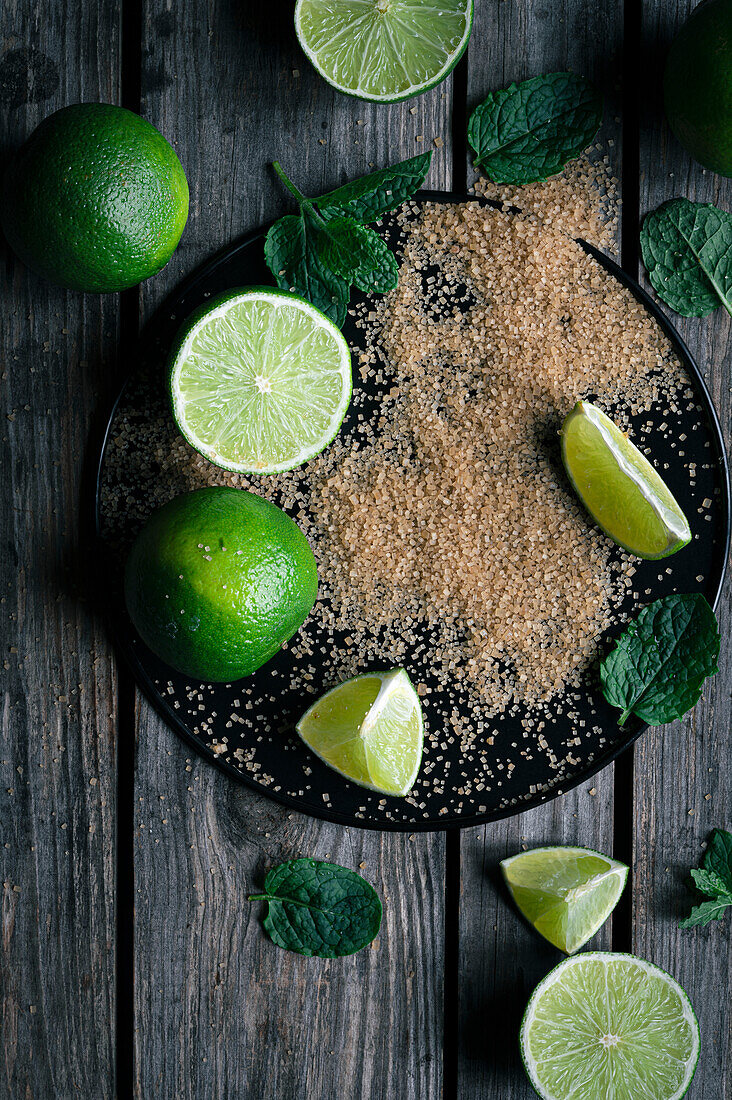 Lime, mint and cane sugar on a tray