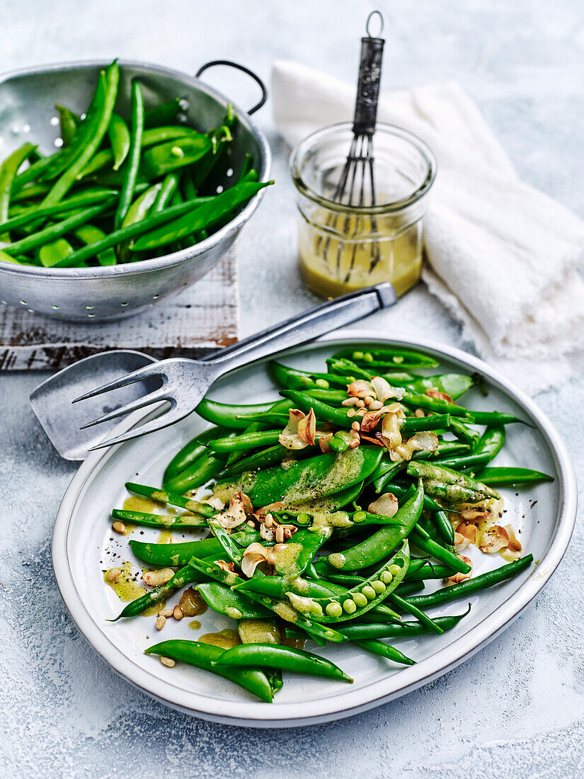 Garlicky green beans and peas with pine nuts