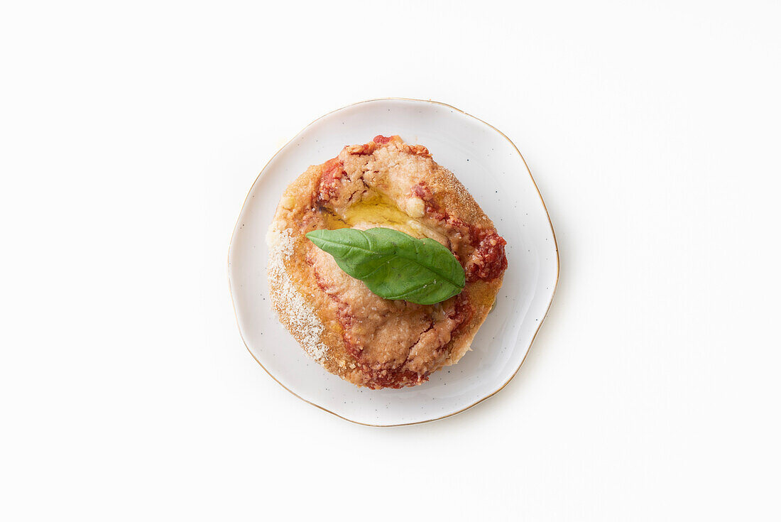 Montanarine (deep-fried pizza) with tomato sauce, parmesan and basil