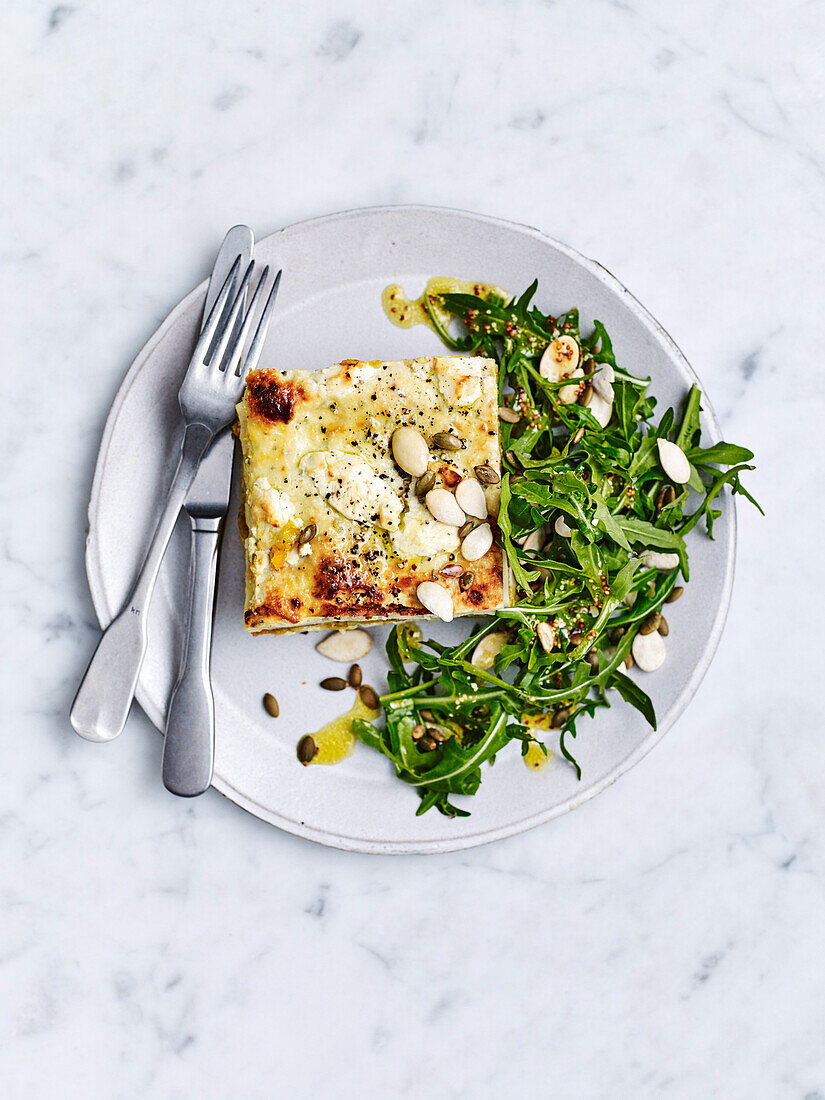 Pumpkin and goat's cheese lasagne with rocket and pepita salad