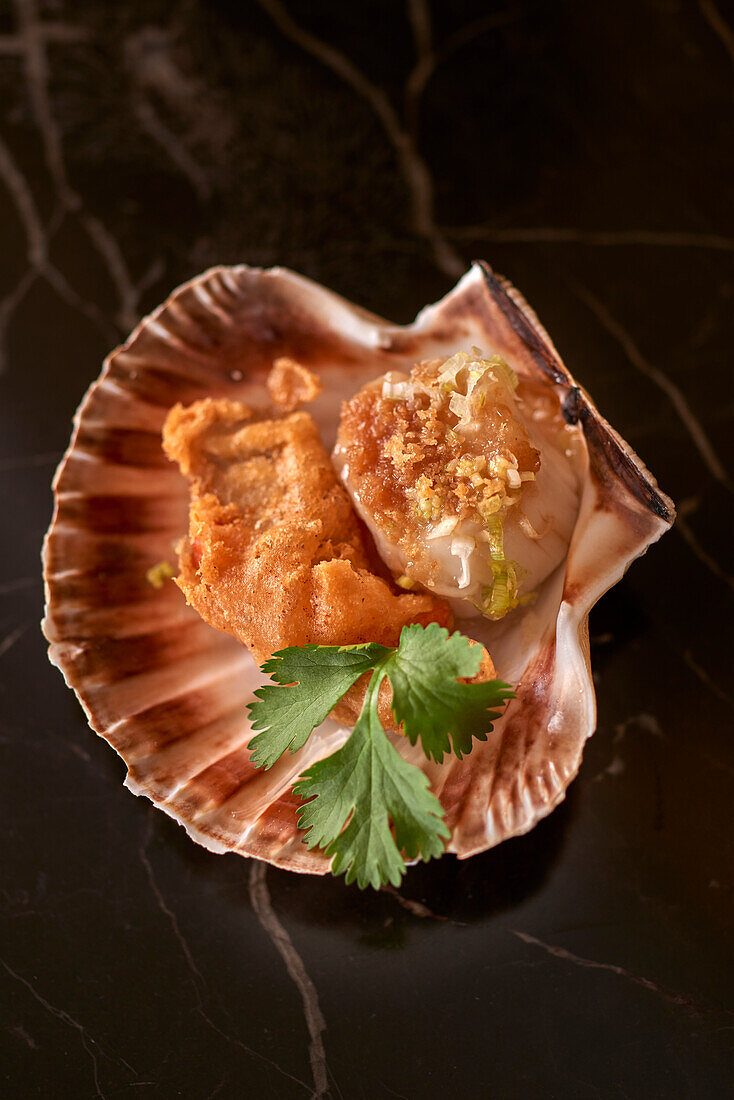 Fried oysters and scallops in shell