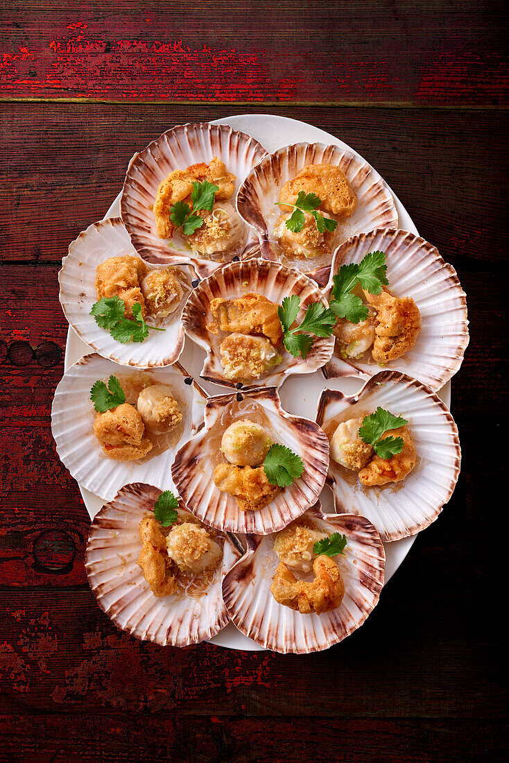 Fried oysters and scallops in scallop shells