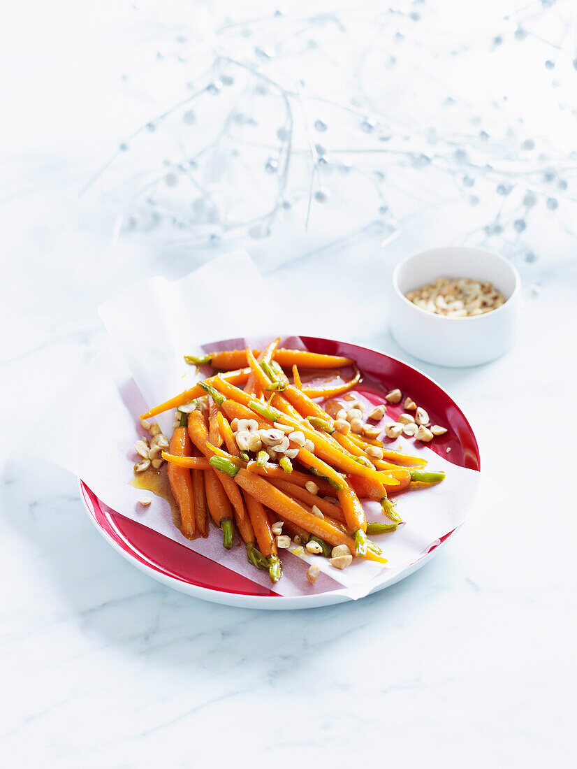 Glazed baby carrots with hazelnuts