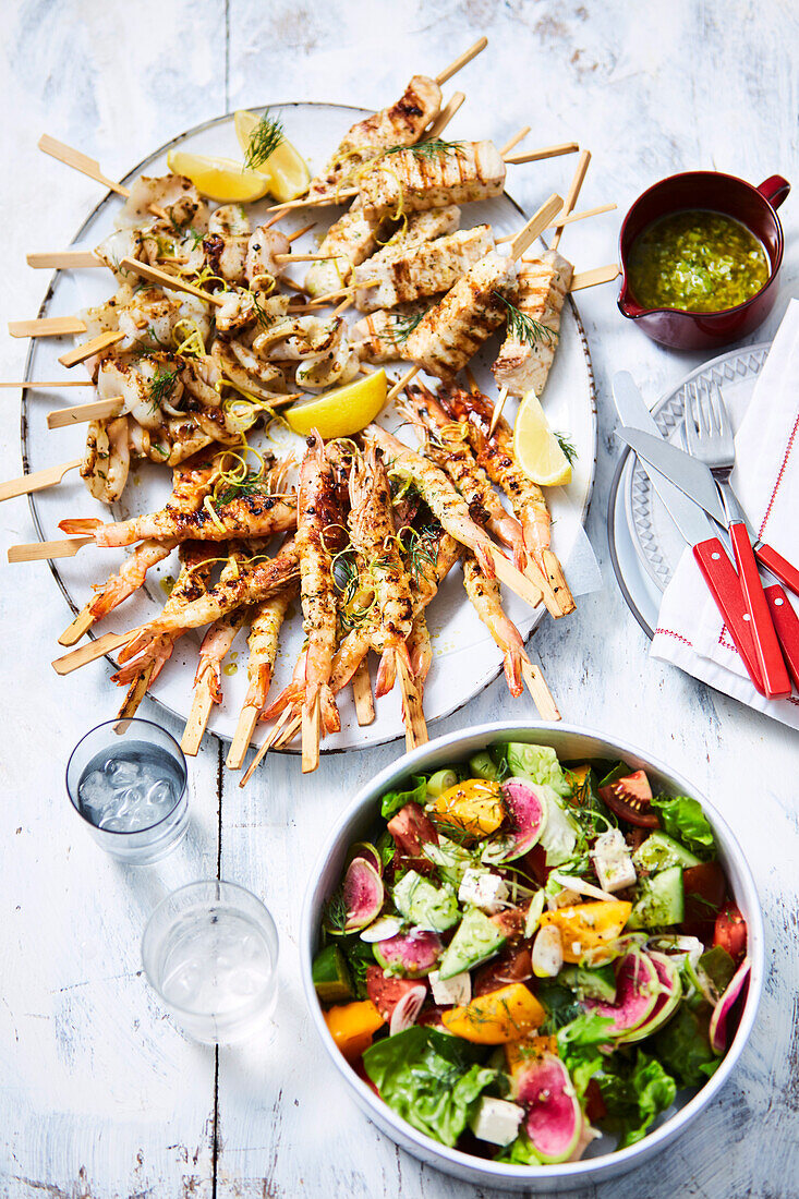 Lemon and dill seafood skewers with salad