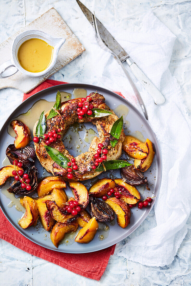 Roast pork wreath with stone fruit