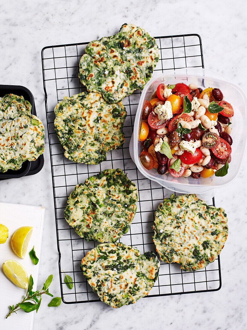 Spinach and yoghurt flatbreads with tomato and olive salad