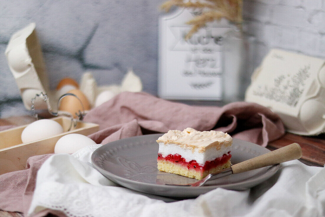 Slice of red currant meringue pie