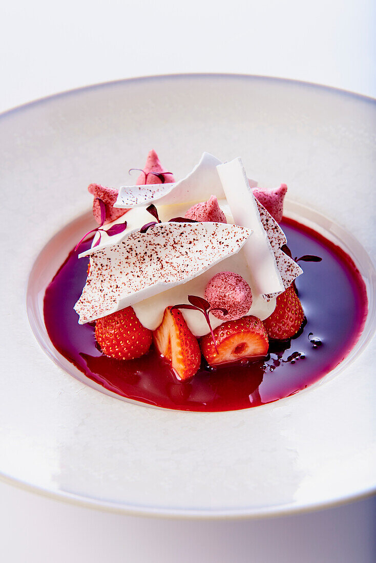 Strawberry dessert with coconut yogurt and meringue