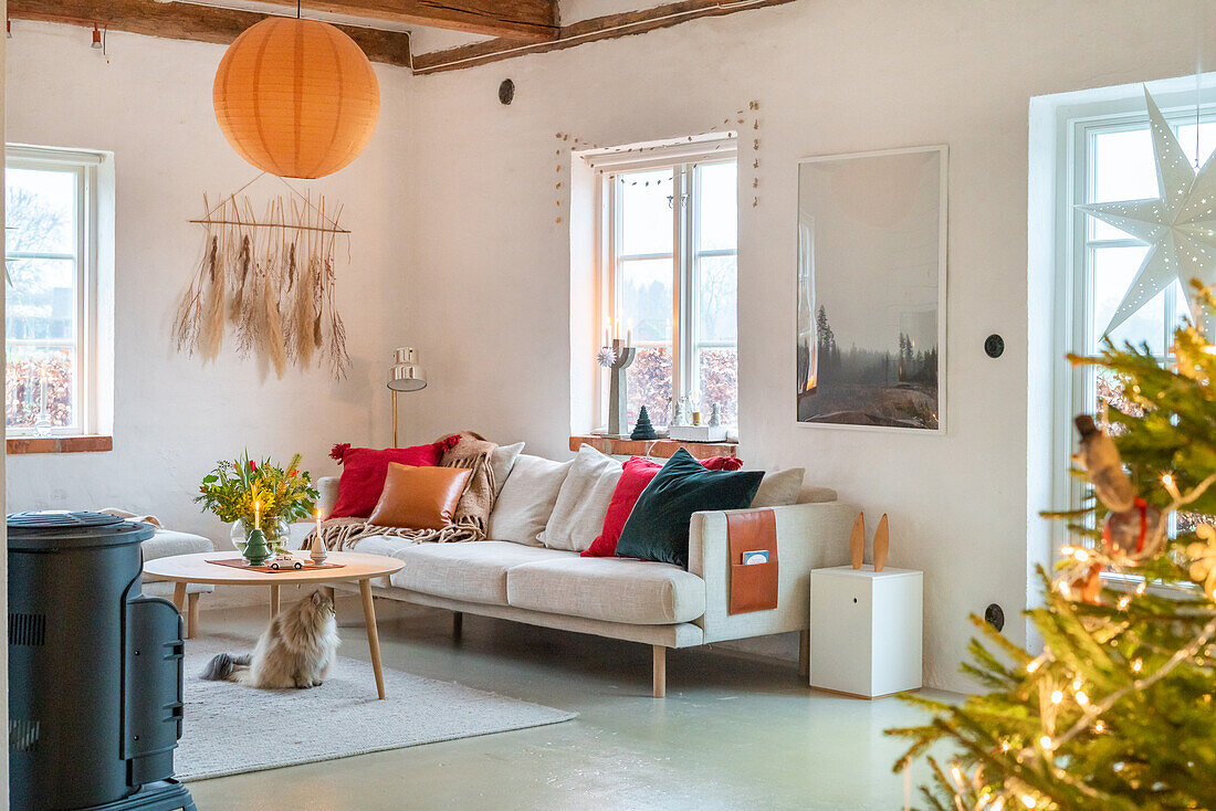 Living room with Christmas decorations and wood-burning stove