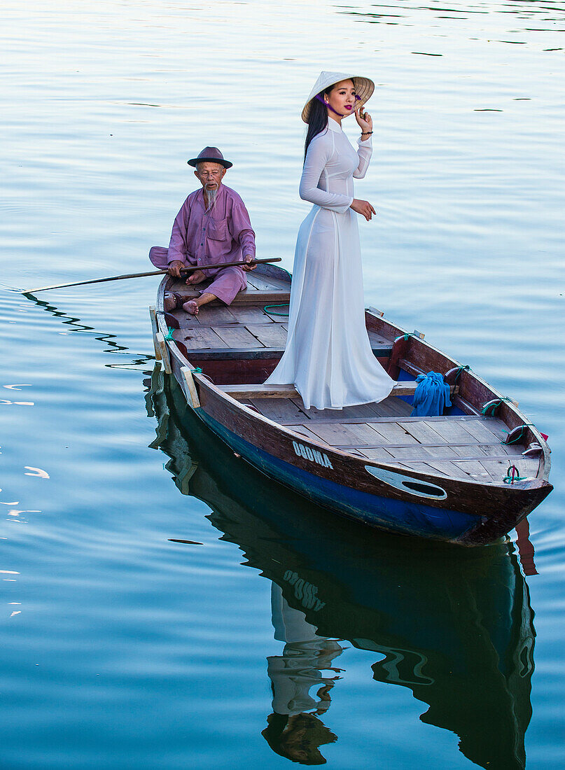 Vietnamese woman wearing Ao Dai dress during the Mid autumn festiaval in Hoi An Vietnam