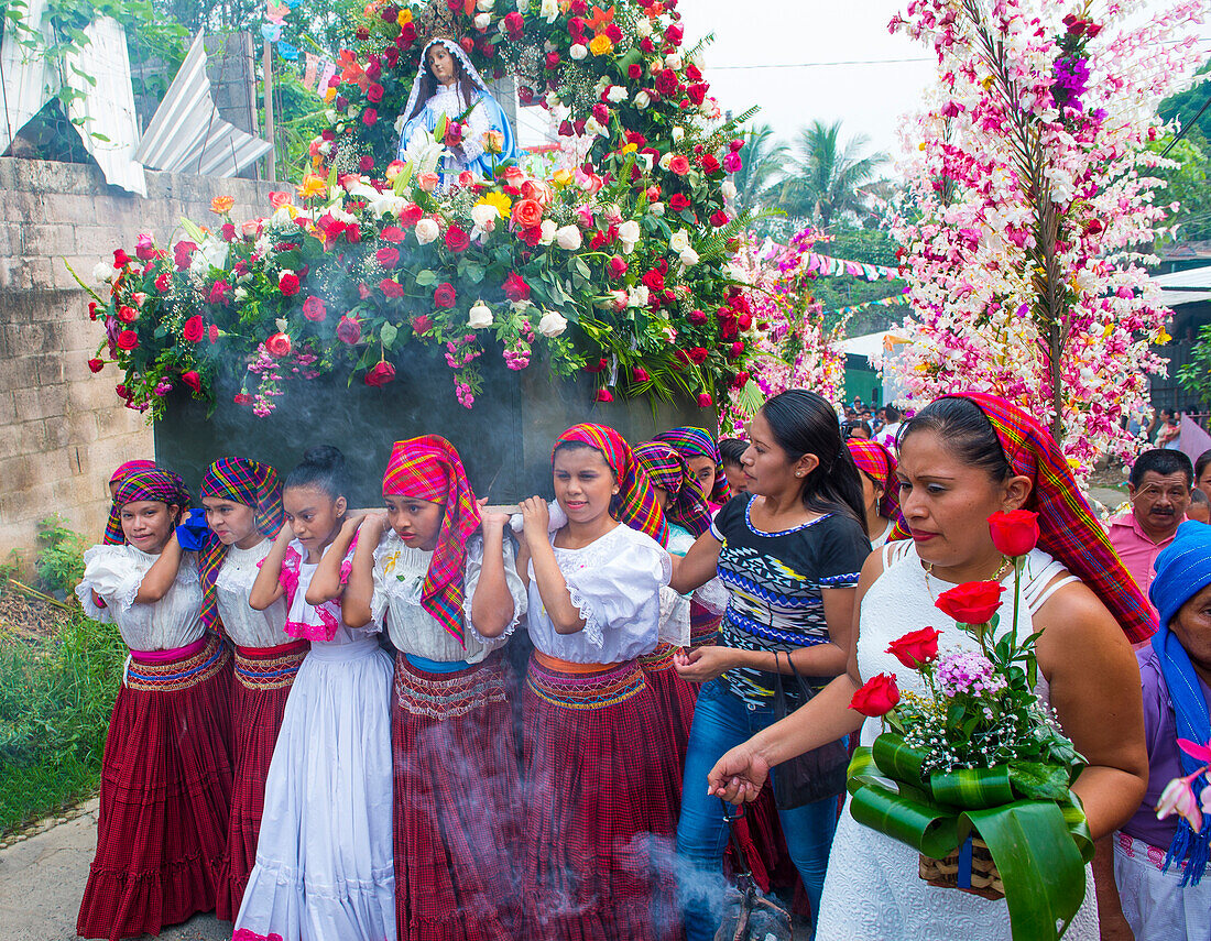 Salvadorian people participate in the procession of the Flower & Palm Festival in Panchimalco, El Salvador