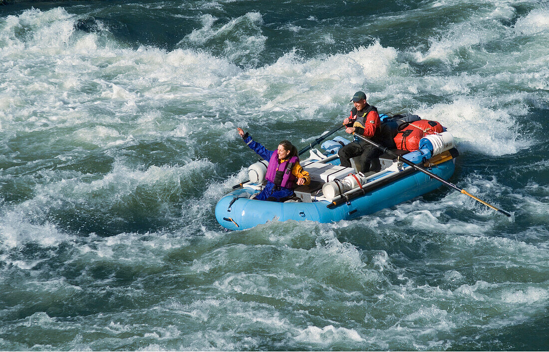 Whitewater rafting through Grave Creek Rapids on the Rogue River, Oregon.