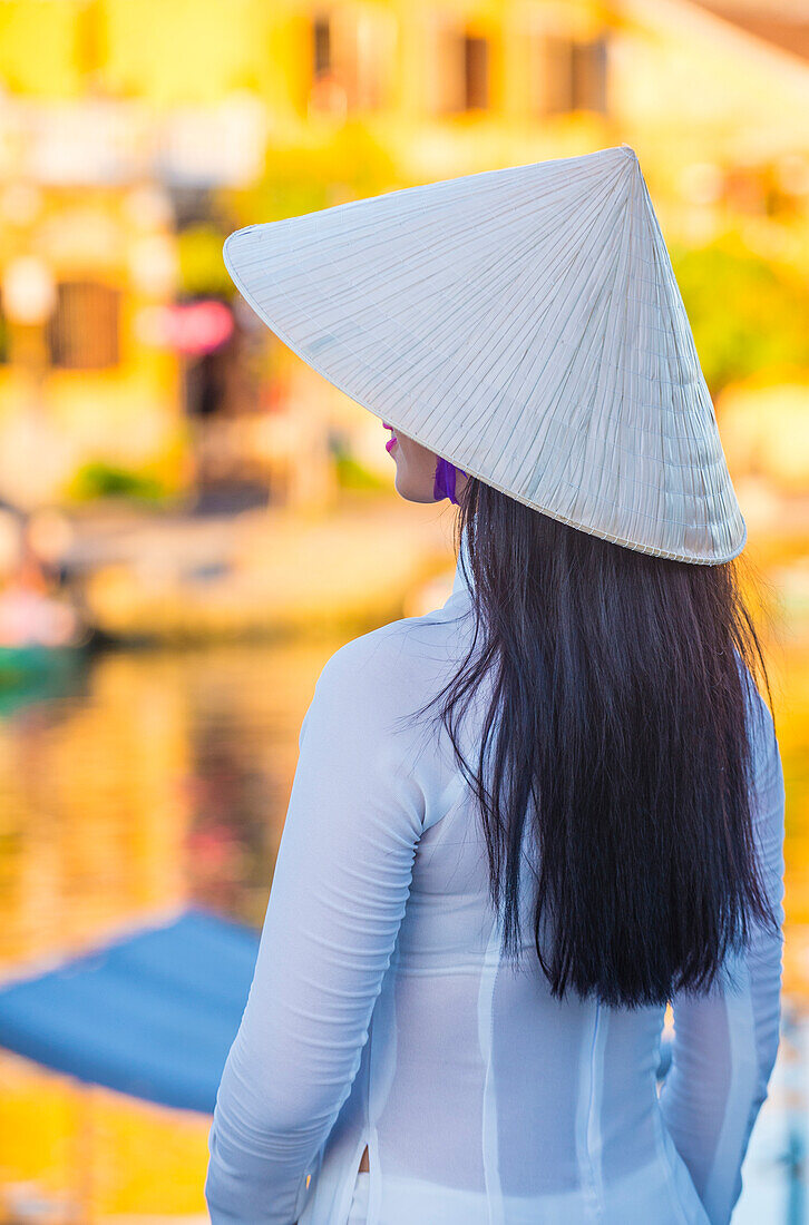 Vietnamese woman wearing Ao Dai dress during the Mid autumn festiaval in Hoi An Vietnam