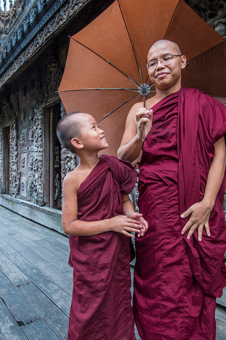 Monks at Shwenandaw Monastery in Mandalay, Myanmar