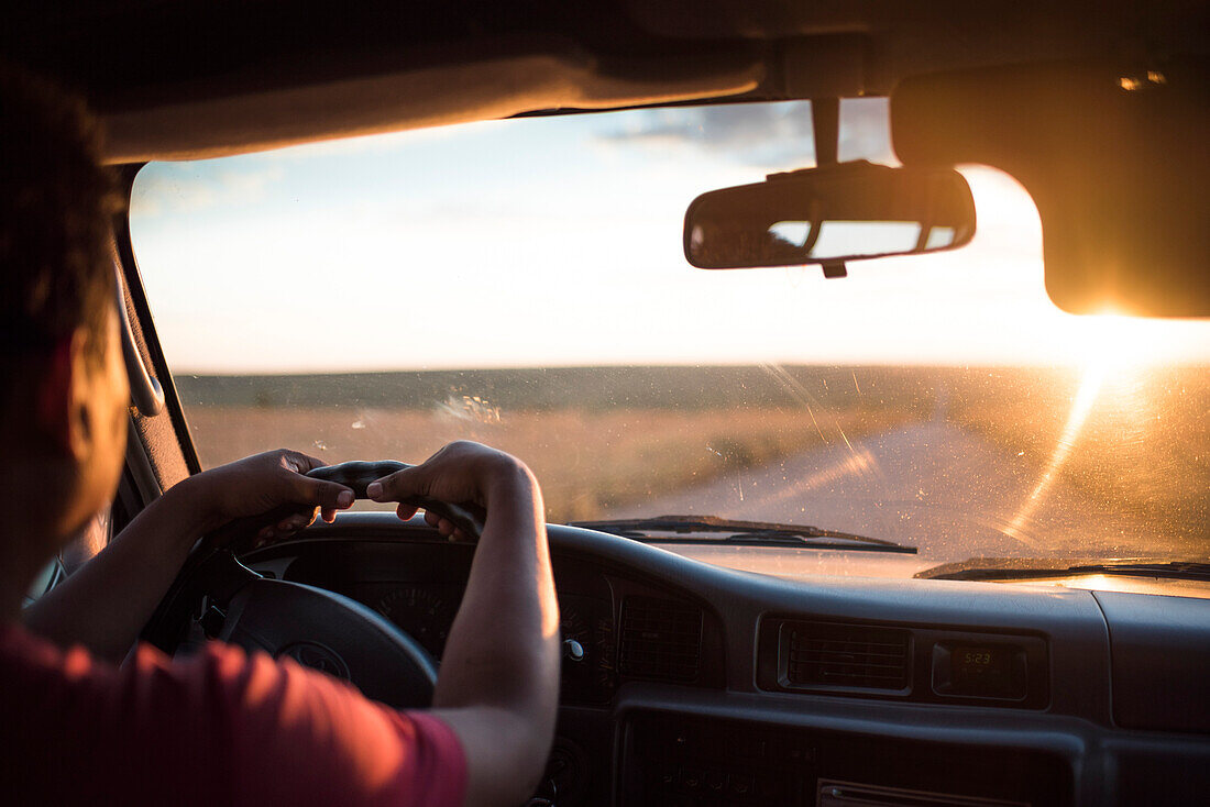 Driving on RN7 (Nationale Route 7) at Isalo National Park at sunset, Southwestern Madagascar