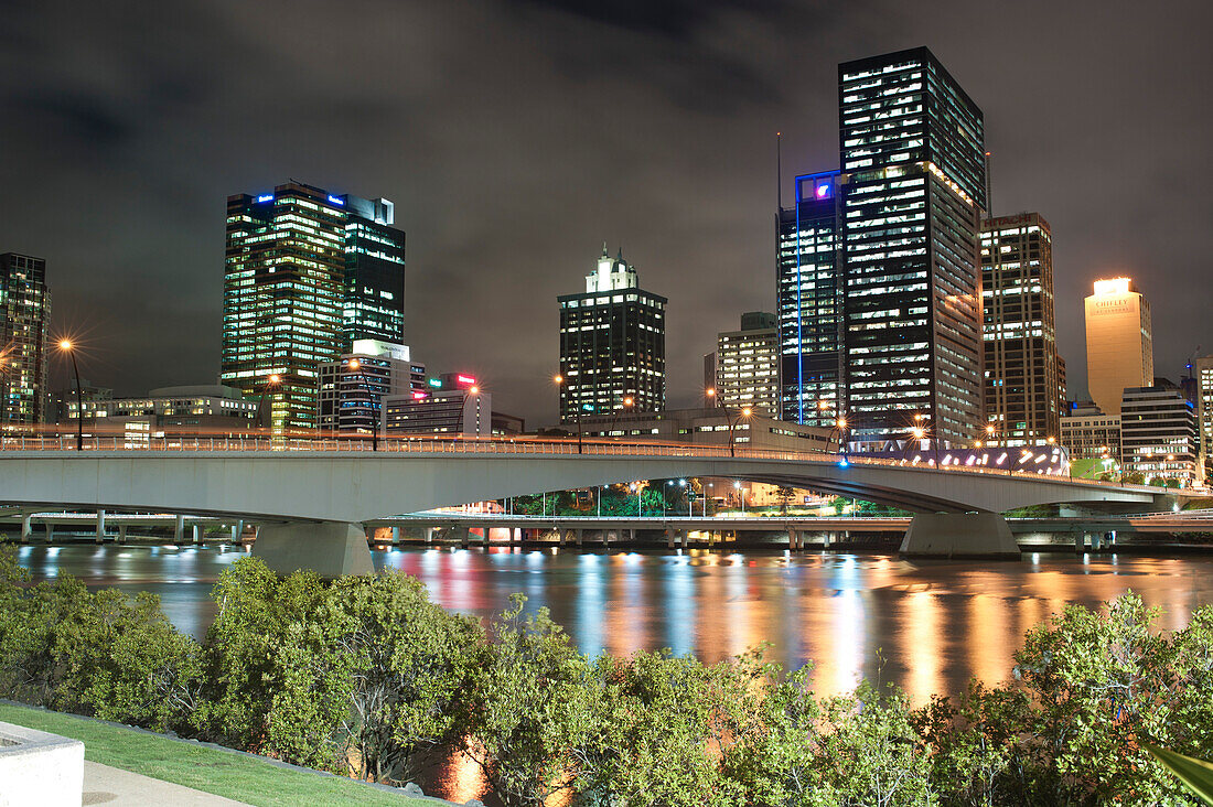 Reflection of Colourful Lights of Brisbane City Centre Skyline in Brisbane River at Night, Queensland, Australia. This photo of Brisbane River and the reflection of Brisbane city centre Skyline at Night was taken from South Bank.