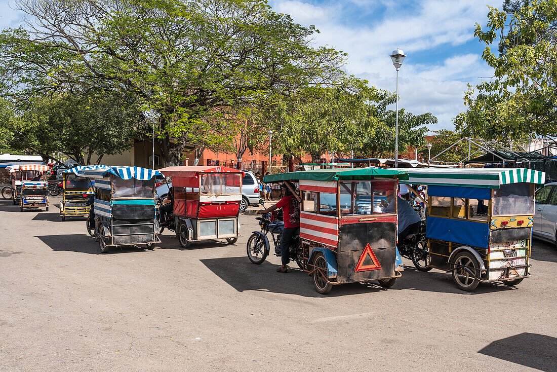 Mototaxis waiting for customers by the market in Muna, Yucatan, Mexico.