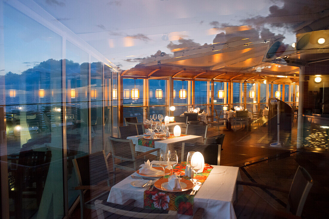 Restaurant in the luxury Paul Gauguin cruise, Society Islands, Tuamotus Archipelago, French Polynesia, South Pacific.