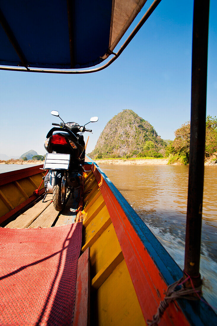 Moped on a boat in Chiang Rai, Thailand, Southeast Asia, Asia
