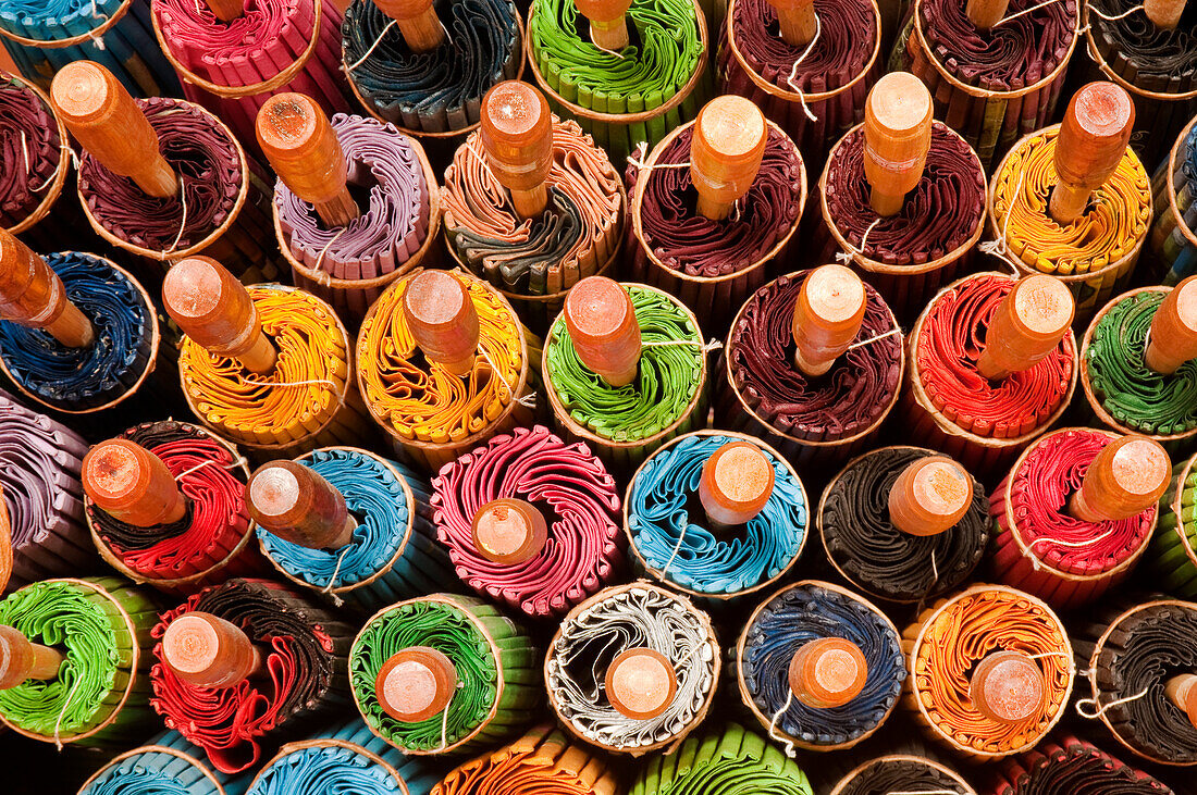 Rolled up umbrellas at The Umbrella Factory in Chiang Mai, Thailand.