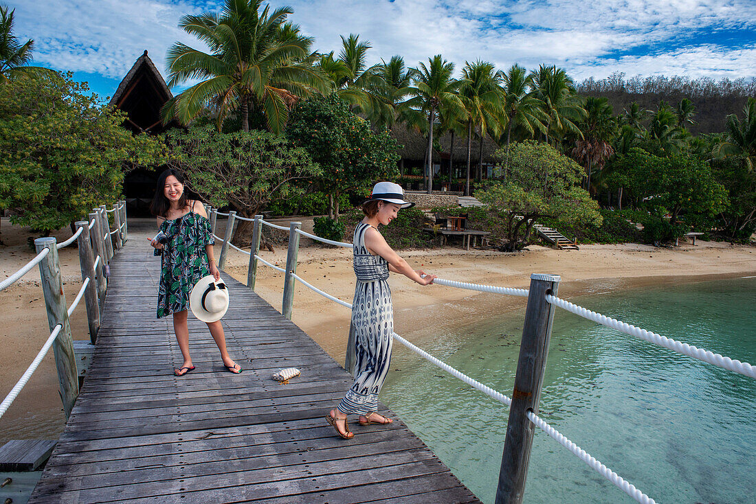 Asian tourist in Likuliku Lagoon Resort, Overwater Bures at Five Star Resort, Malolo Island, Mamanucas, Fiji