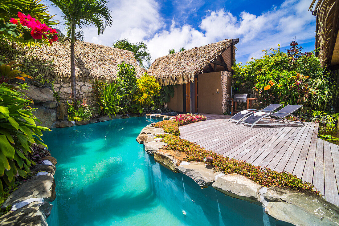 Luxury Villa accommodation with private outdoor swimming pool and seating area with sun loungers, Muri, Rarotonga, Cook Islands