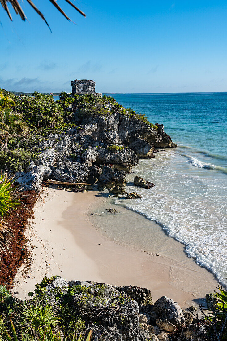 The Temple of the Wind God in the ruins of the Mayan city of Tulum on the coast of the Caribbean Sea. Tulum National Park, Quintana Roo, Mexico.