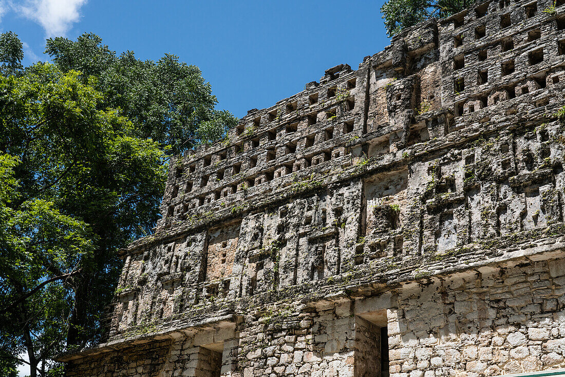 The roof comb of Temple 33 in the ruins of the Mayan city of Yaxchilan on the Usumacinta River in Chiapas, Mexico. Originally, it was plastered with stucco and painted bright colors.