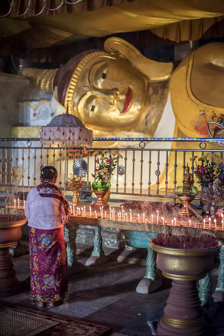 Buddhist woman praying inside Sadan Cave (aka Saddar Caves), Hpa An, Kayin State (Karen State), Myanmar (Burma)