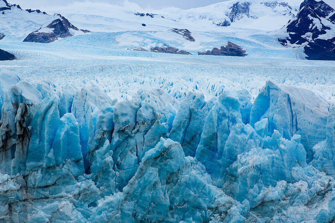 The jagged blue ice on the face of Perito Moreno Glacier in Los Glaciares National Park near El Calafate, Argentina. A UNESCO World Heritage Site in the Patagonia region of South America.