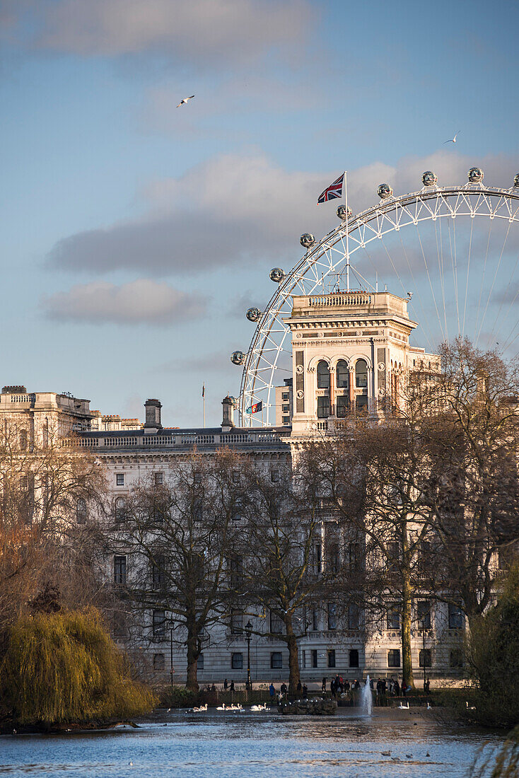 Her Majestry's Treasury and the London Eye, seen from St James's Park, London, England