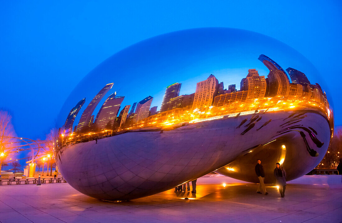 View of the Cloud Gate sculpture in Millennium Park in Chicago , The sculpture is nicknamed The Bean , designed by British artist Anish Kapoor.