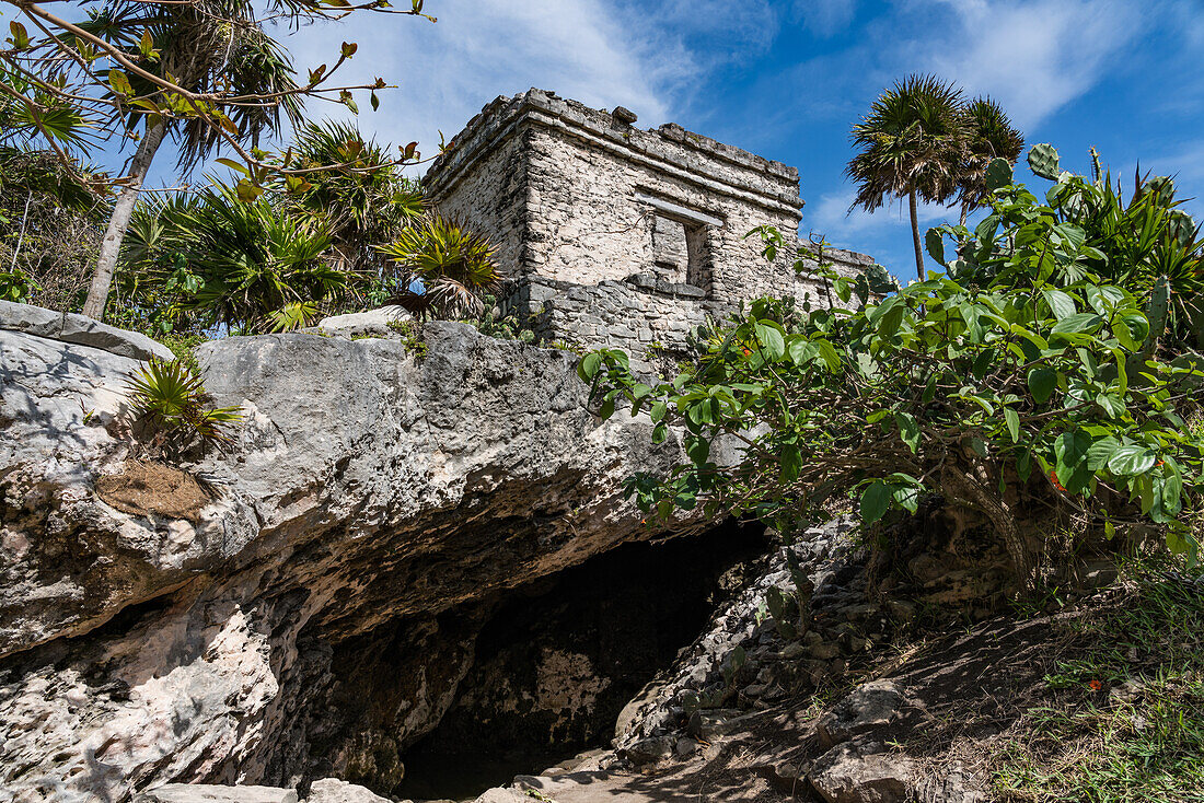 The House of the Cenote in the ruins of the Mayan city of Tulum on the coast of the Caribbean Sea. Tulum National Park, Quintana Roo, Mexico. It is built over a cave or cenote which holds water.