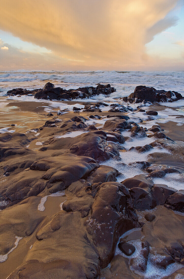 Rocky shore at sunrise, Searose Beach, central Oregon coast.