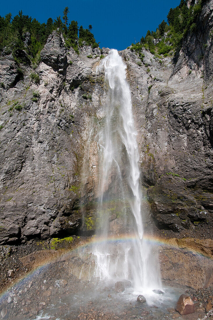 Comet Falls with rainbow; Mount Rainier National Park, Washington.